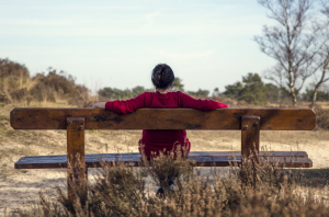 Woman_sitting_on_a_bench_300_198_int_c1-1x.png