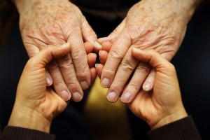 Holding_elderly_hands_300_200_int_c1-1x.jpg