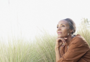 Woman_looking_pensive_in_field_300_207_int_c1-1x.jpg